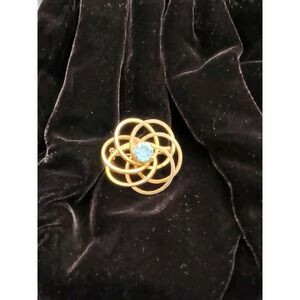 Vintage Mid-Century Gold Tone Atomic Swirl Brooch with Blue Rhinestone, 1950s.